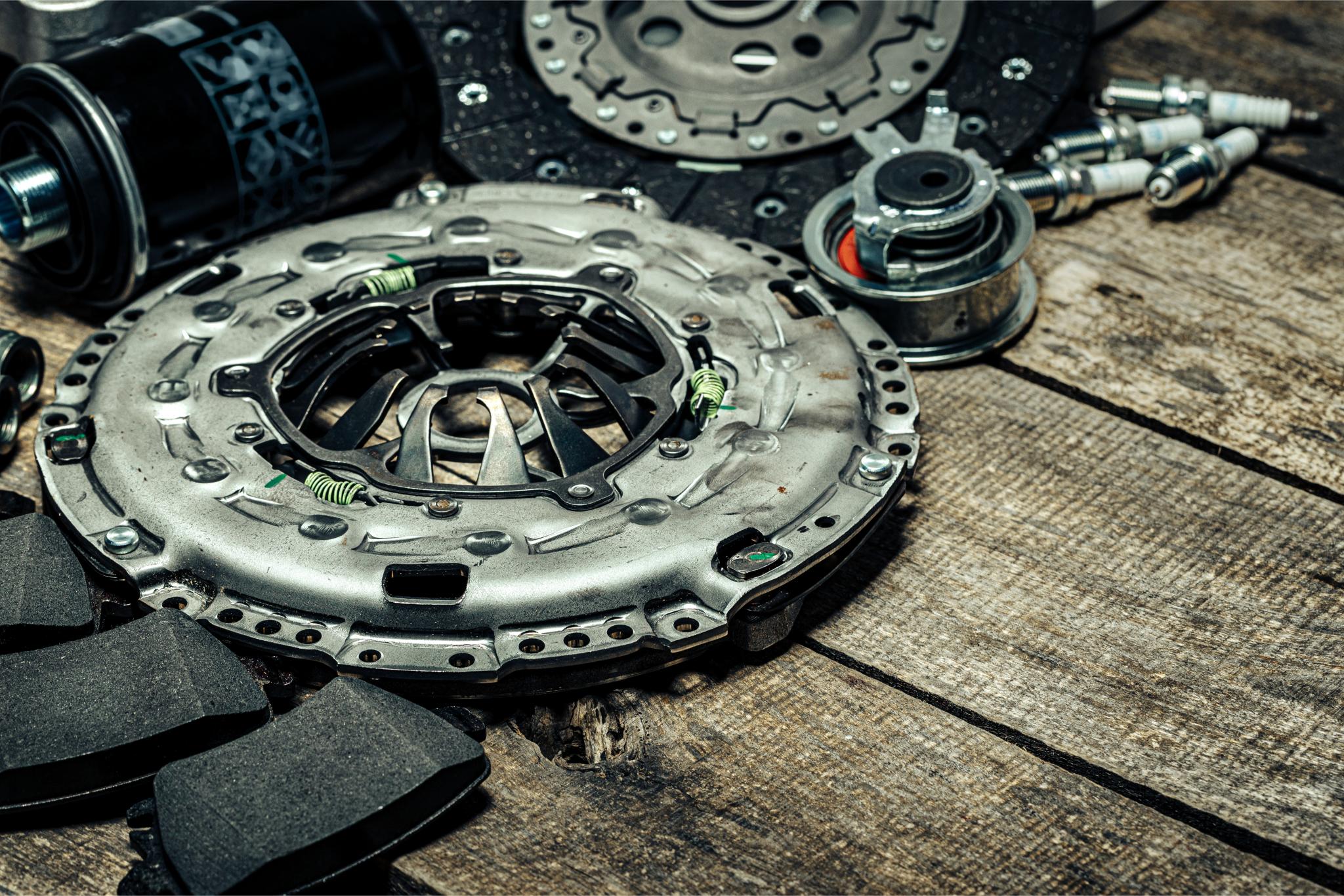 Inspecting worn clutch disc in Northern Beaches workshop