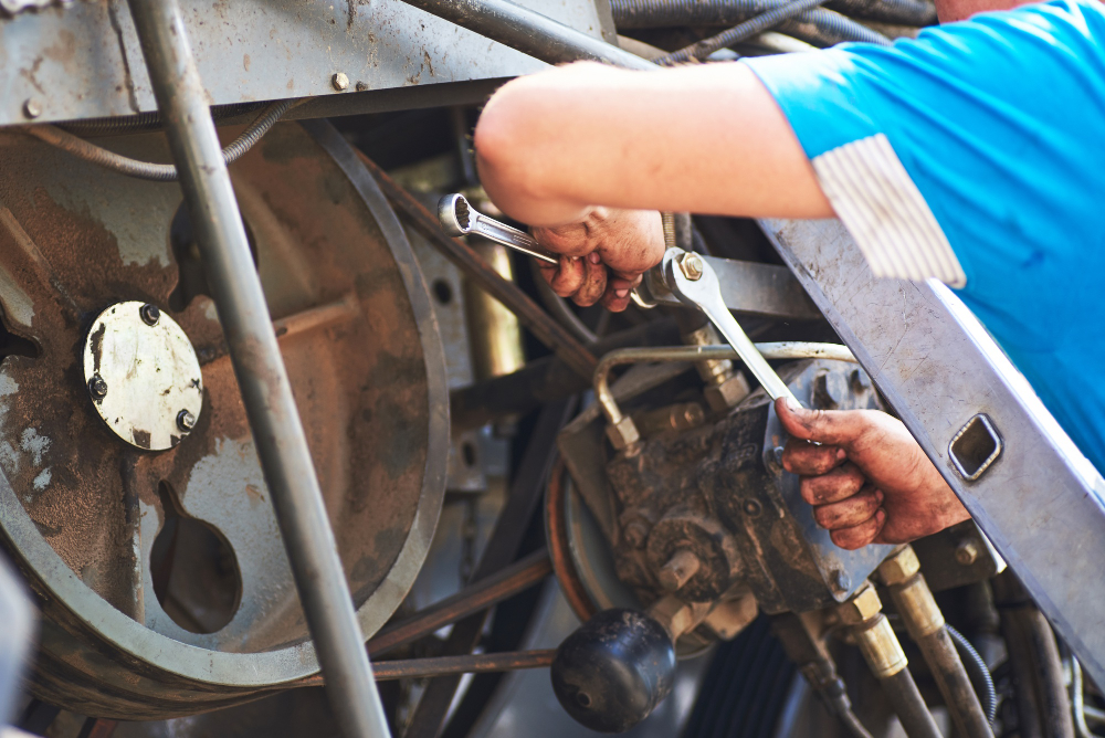 mechanic inspecting caravan brake system in Northern Beaches workshop