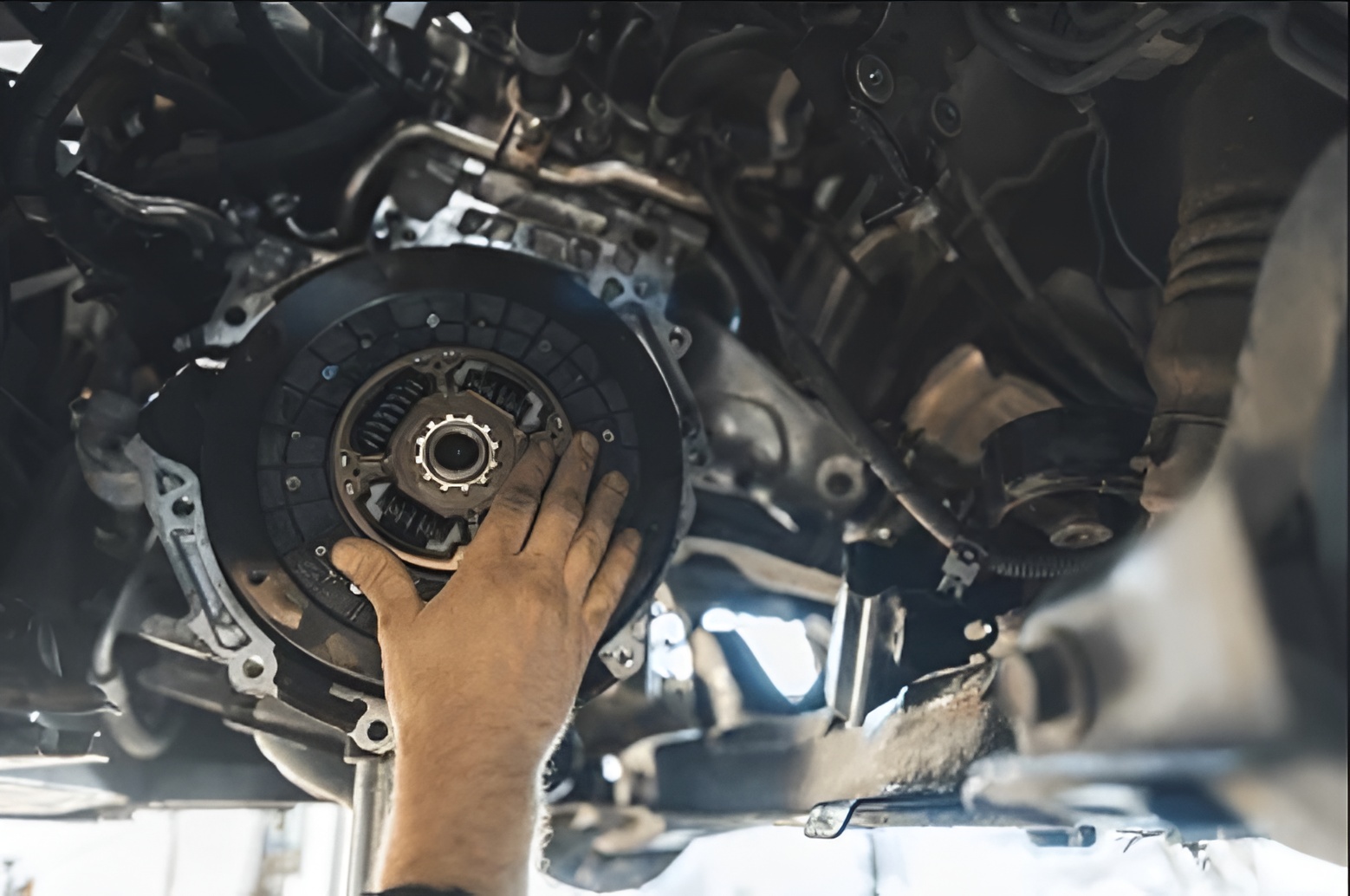 Mechanic inspecting a worn clutch in a Northern Beaches workshop