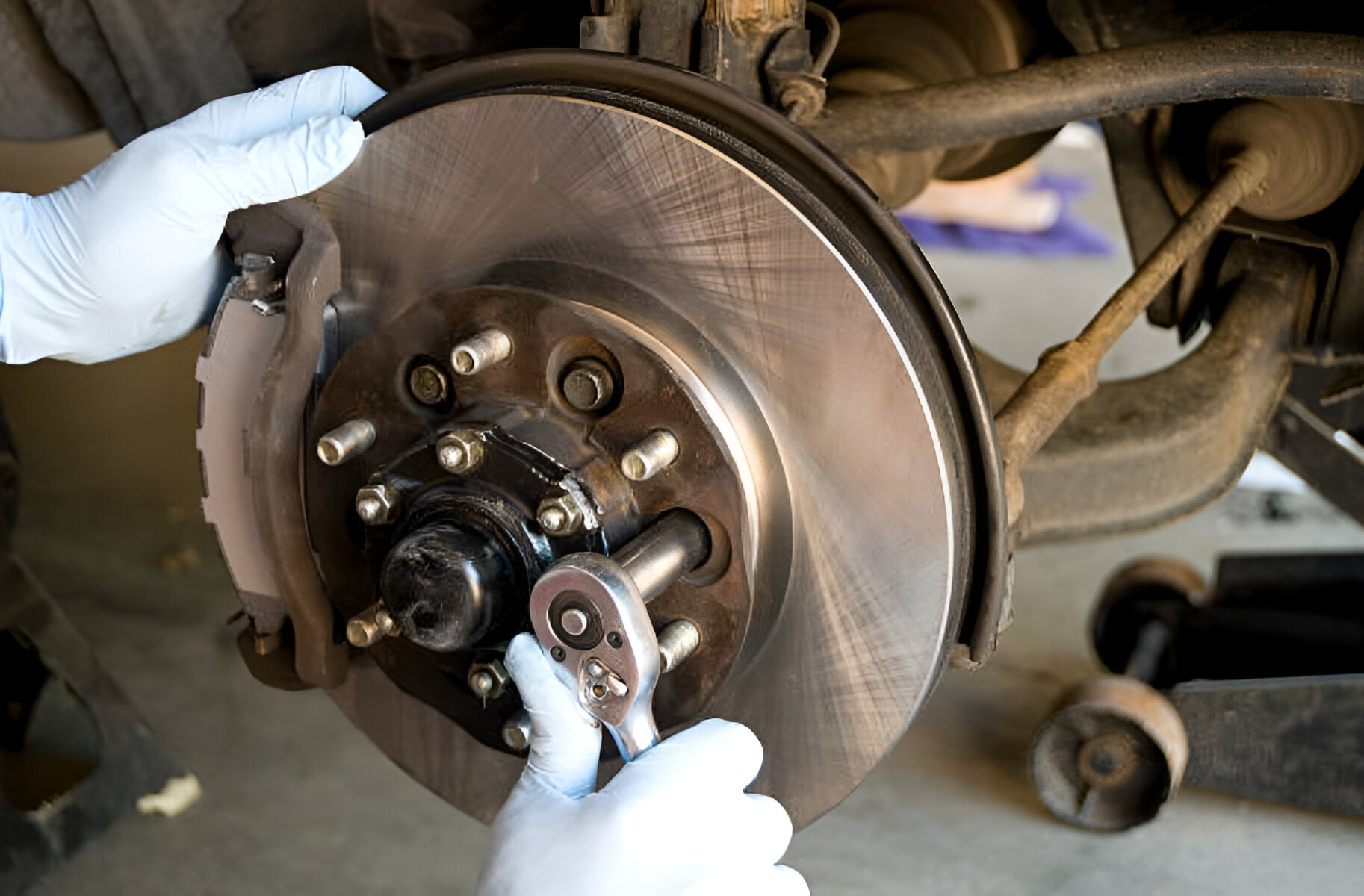 - Warringah Brake & Clutch Centre – Clutches, Brakes, Rotors Mechanic inspecting brake components on a heavy vehicle as part of an HVAIS inspection