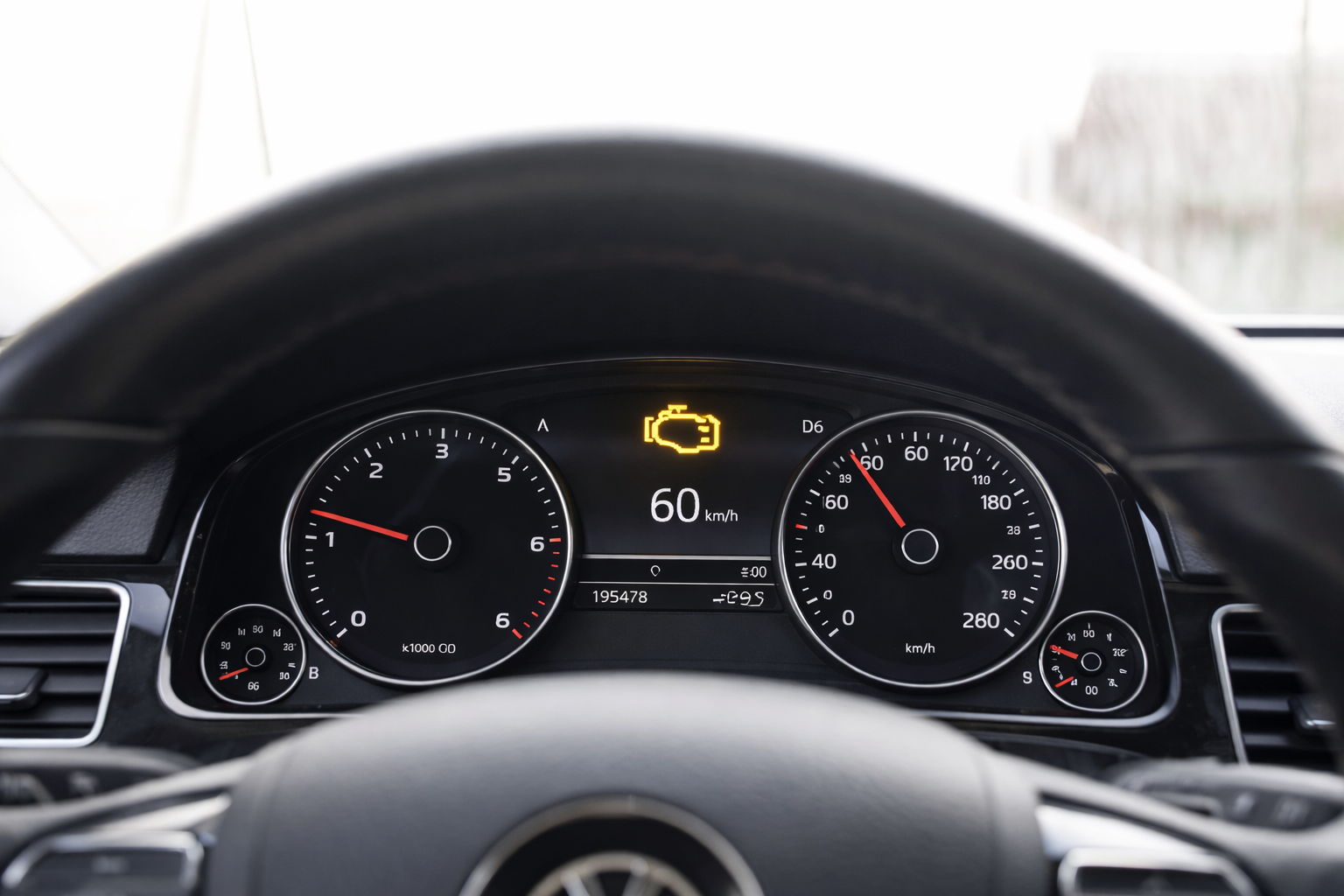 Check engine light illuminated on car dashboard
